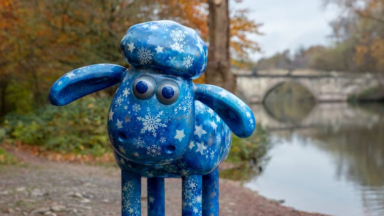 Sculpture of Shaun the Sheep decorated in blue with silver snowflakes